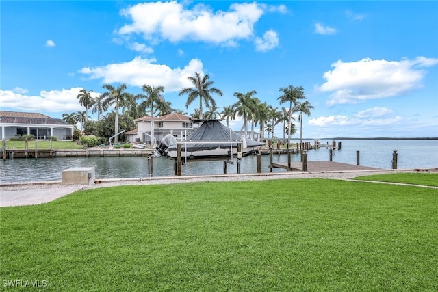 view of dock featuring a yard and a water view