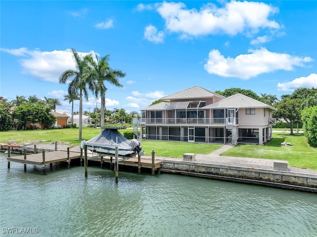 view of dock featuring a yard and a water view