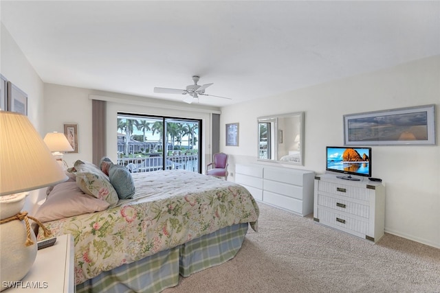 carpeted bedroom featuring ceiling fan and access to exterior