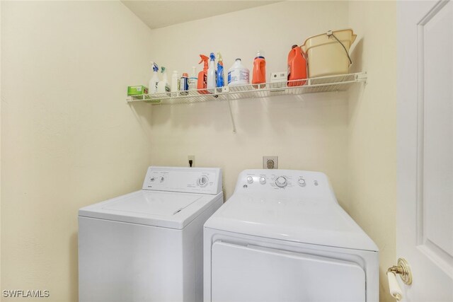 laundry room featuring washing machine and dryer