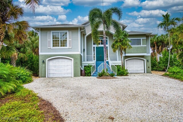 view of front of home with a garage and a porch