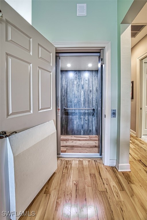 entryway with light hardwood / wood-style flooring