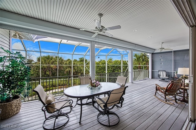 sunroom / solarium with ceiling fan