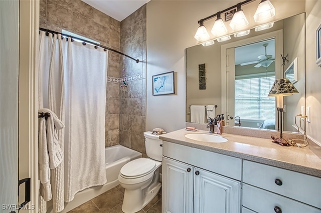 full bathroom featuring vanity, shower / tub combo, tile patterned flooring, toilet, and ceiling fan