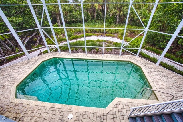 view of pool with a lanai