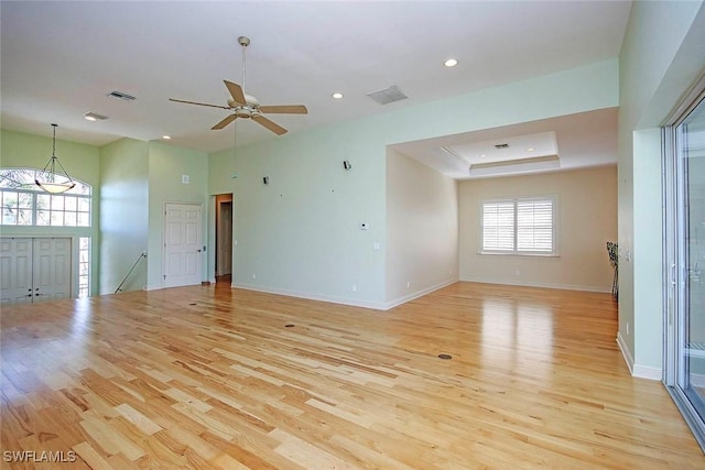 unfurnished room featuring light wood-style floors, baseboards, visible vents, and recessed lighting