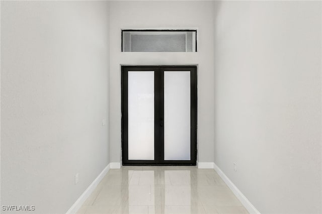 foyer featuring light tile patterned floors