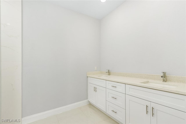 bathroom featuring tile patterned flooring and double sink vanity