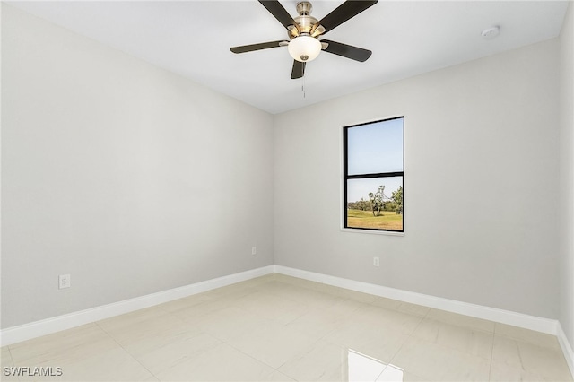 tiled spare room with ceiling fan