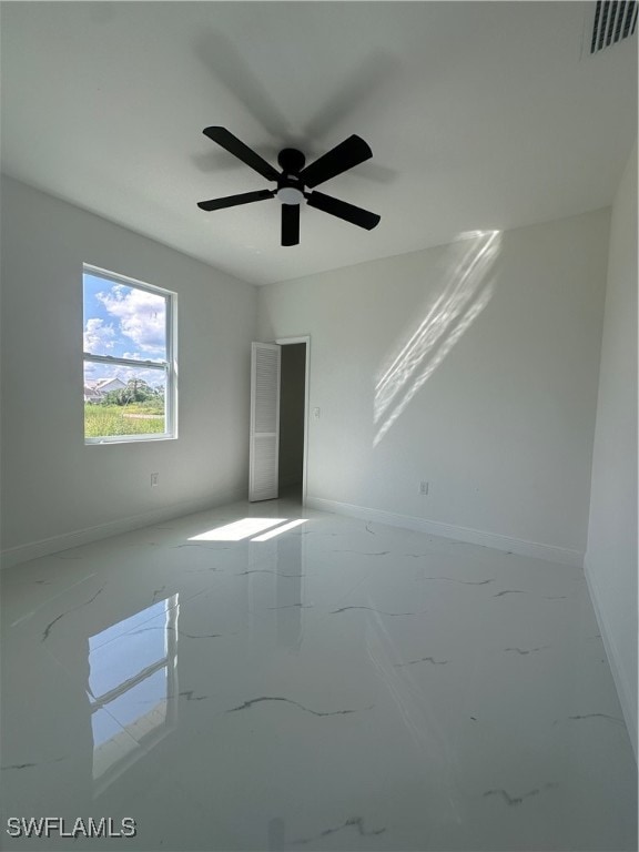 unfurnished room featuring ceiling fan