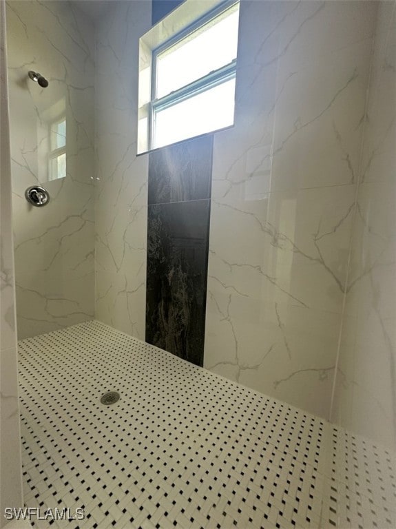 bathroom with tiled shower