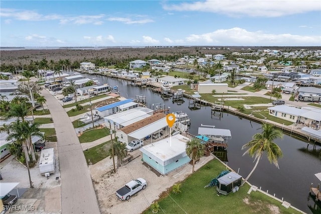 birds eye view of property featuring a residential view and a water view