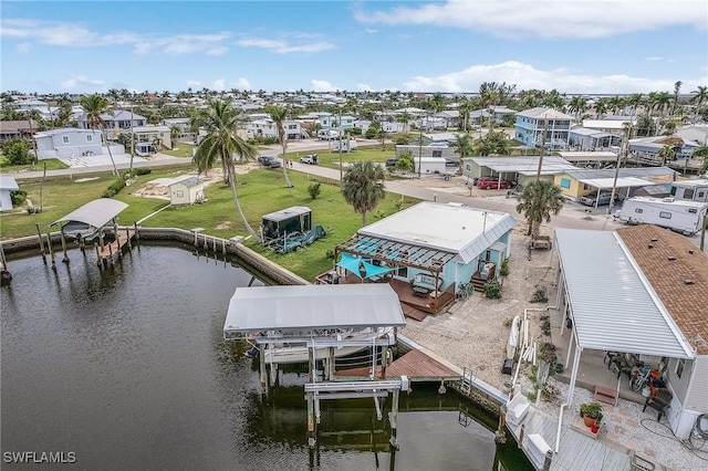 bird's eye view featuring a residential view and a water view