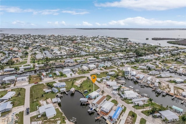 bird's eye view with a residential view and a water view