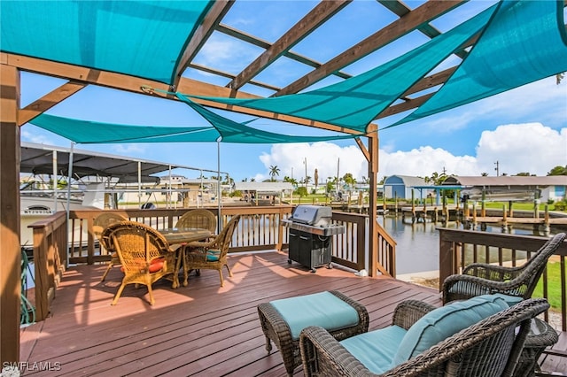 deck featuring a dock, a water view, boat lift, and a grill