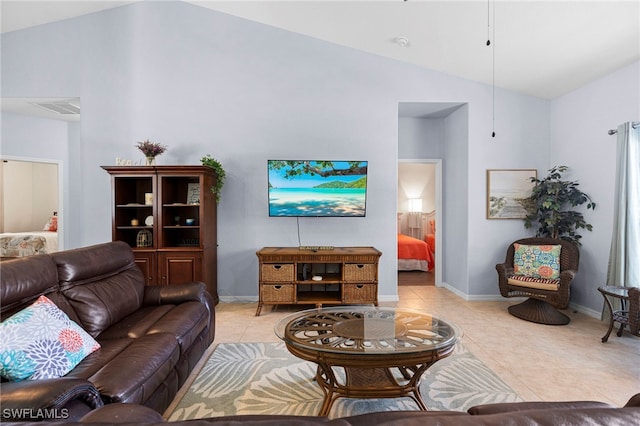 tiled living room featuring high vaulted ceiling