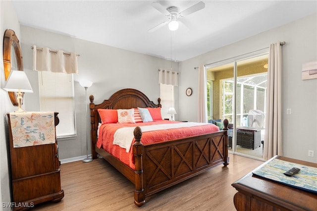 bedroom featuring ceiling fan, light hardwood / wood-style flooring, and access to exterior