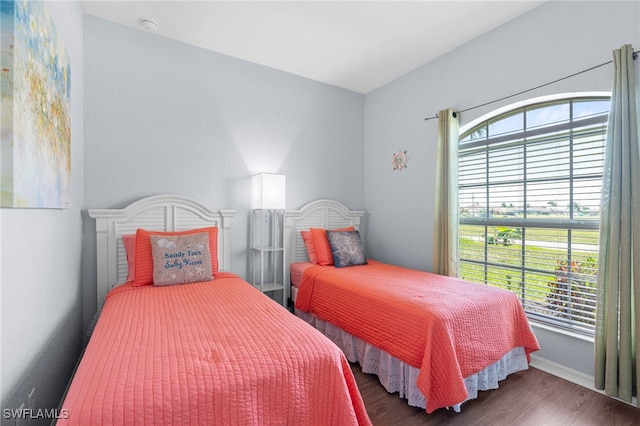 bedroom with hardwood / wood-style floors