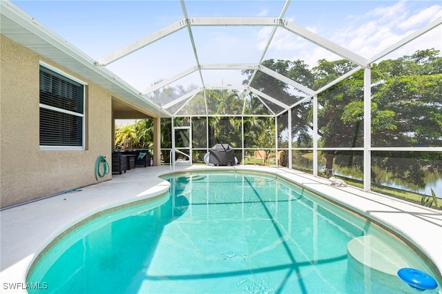 view of pool featuring a patio area and a lanai