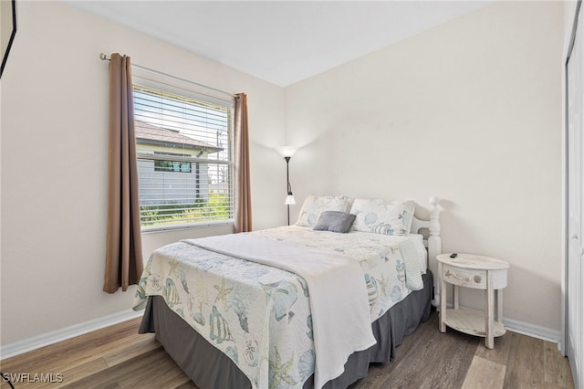 bedroom featuring wood-type flooring