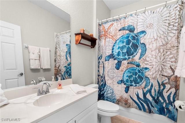 full bathroom featuring tile patterned floors, vanity, shower / bath combo, and toilet