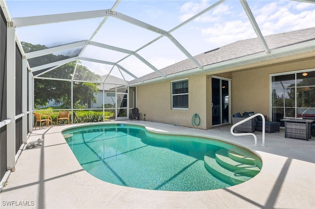 view of pool featuring a lanai and a patio