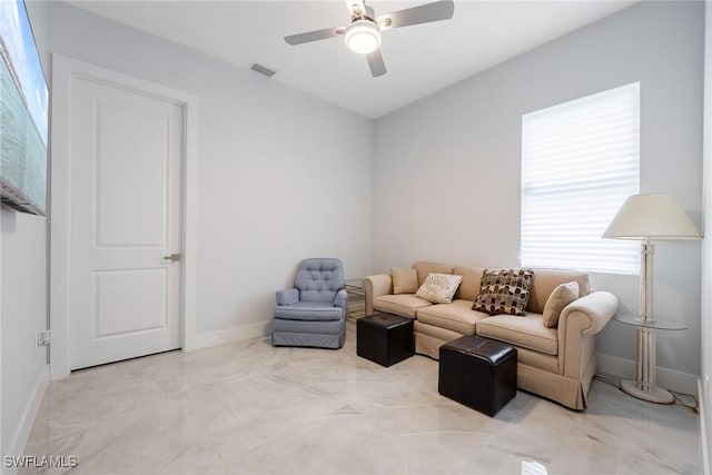 living room featuring baseboards, marble finish floor, visible vents, and a ceiling fan