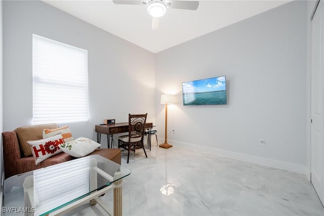 home office featuring ceiling fan and baseboards