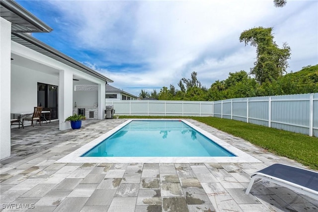 view of swimming pool featuring a patio area, a fenced backyard, and a fenced in pool