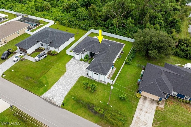 birds eye view of property with a residential view