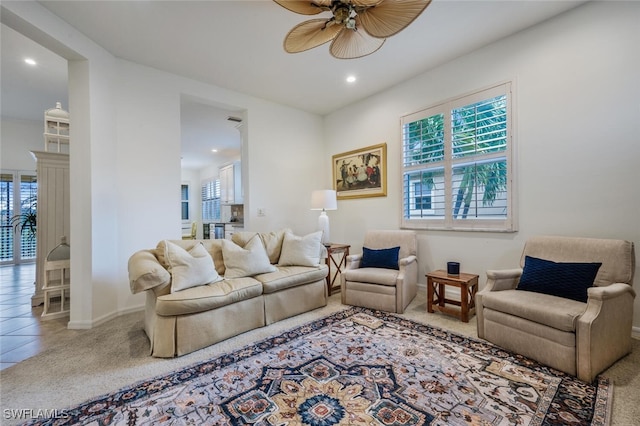 tiled living room featuring ceiling fan