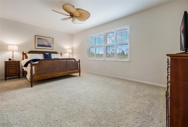 bedroom featuring ceiling fan and light carpet