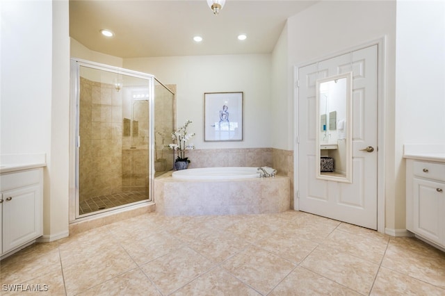 bathroom featuring tile patterned flooring, plus walk in shower, and vanity