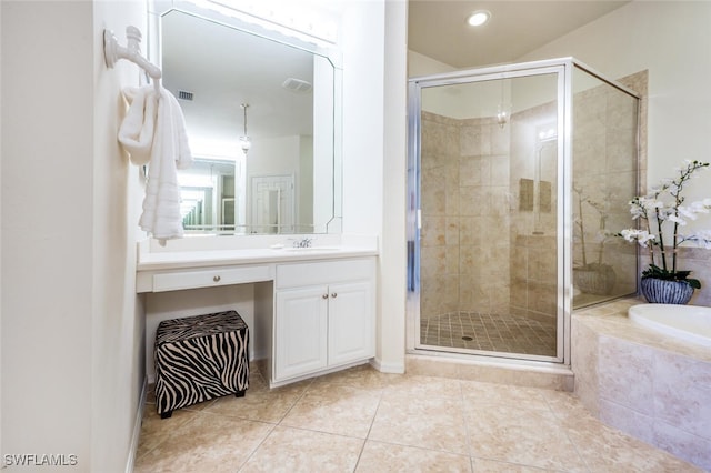 bathroom with tile patterned floors, plus walk in shower, and vanity