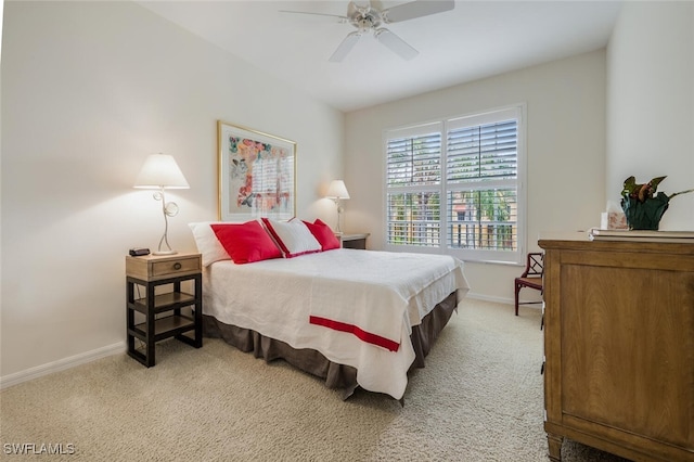 bedroom featuring ceiling fan and light carpet