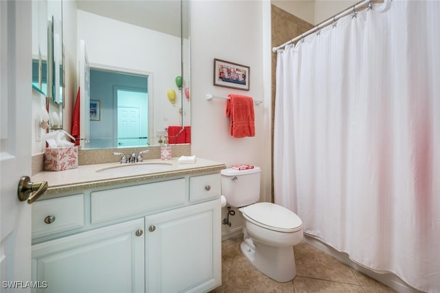 bathroom featuring tile patterned flooring, toilet, a shower with shower curtain, and vanity