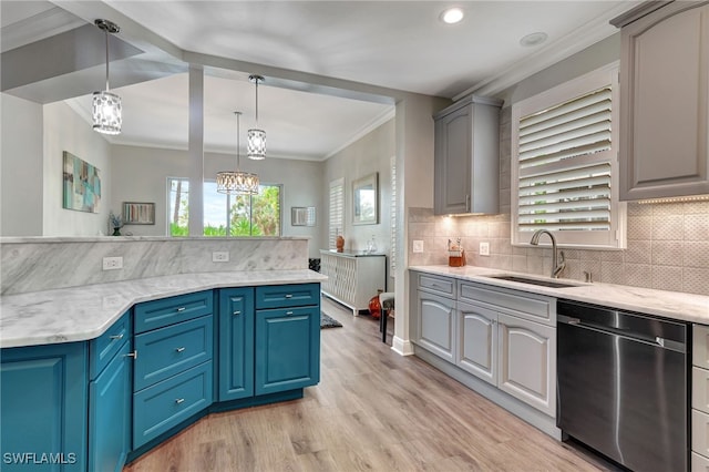 kitchen featuring dishwasher, ornamental molding, blue cabinets, pendant lighting, and a sink