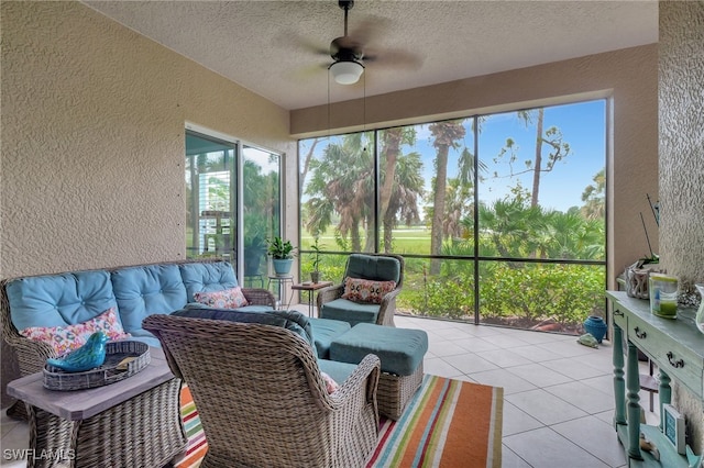 sunroom featuring ceiling fan