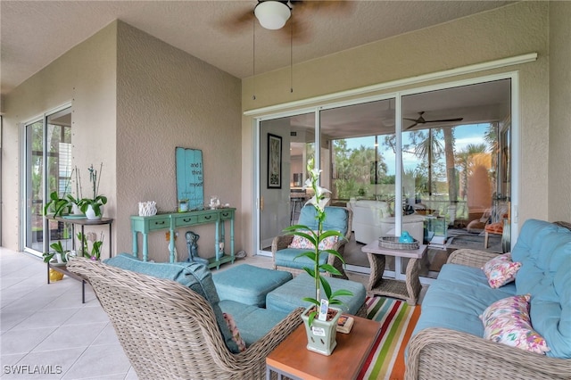 view of patio featuring ceiling fan and an outdoor living space