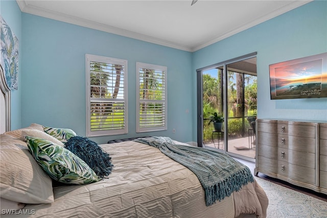 bedroom featuring ornamental molding and access to exterior