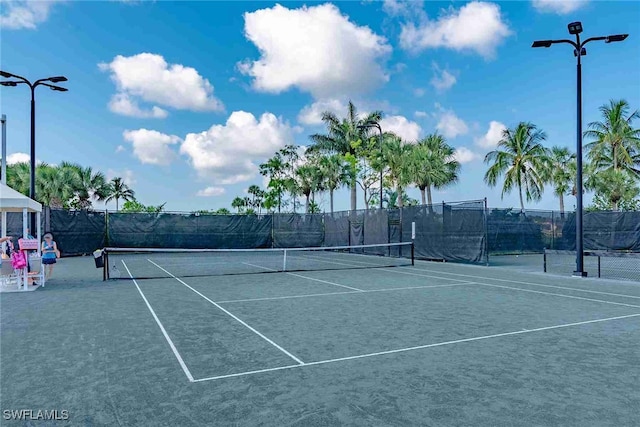 view of sport court with fence