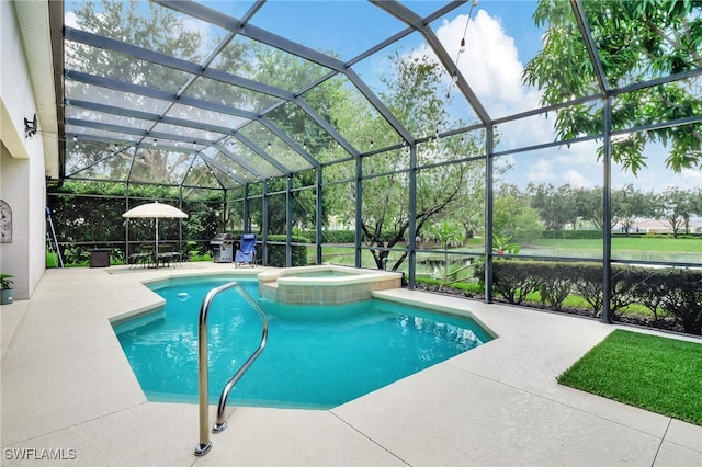 view of swimming pool featuring a lanai, a patio area, and an in ground hot tub