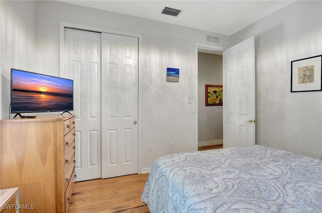 bedroom featuring a closet and light hardwood / wood-style floors