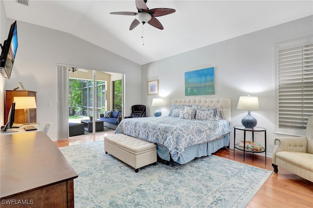 bedroom featuring lofted ceiling, access to exterior, ceiling fan, and hardwood / wood-style flooring