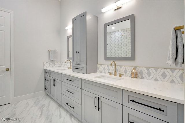 bathroom with tile patterned floors, vanity, backsplash, and walk in shower