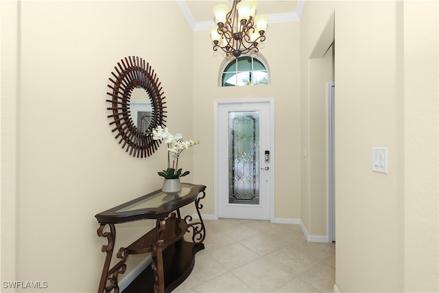 entryway featuring light tile patterned flooring, a chandelier, and ornamental molding