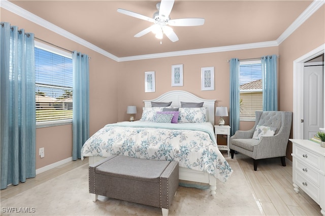 bedroom featuring multiple windows, ceiling fan, and ornamental molding