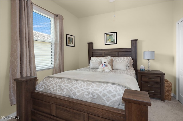 bedroom with light colored carpet