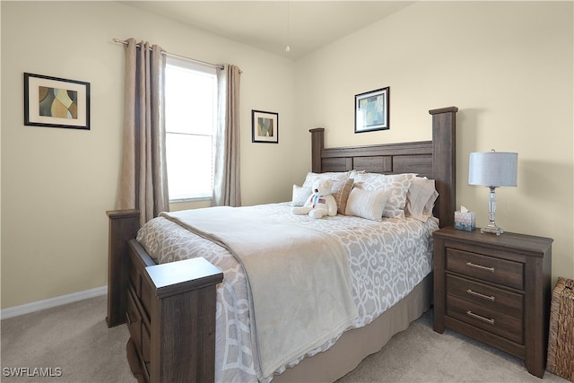 bedroom featuring light colored carpet