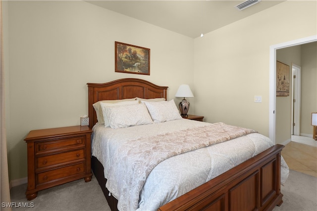 bedroom with light colored carpet